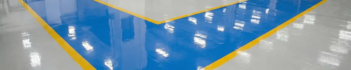 A factory floor professionally covered and marked with epoxy flooring in Staten Island, NY