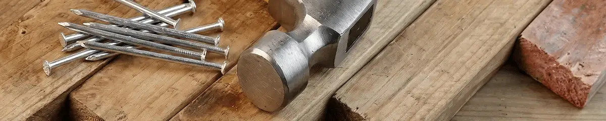 Hammer and nails on hardwood flooring boards in Staten Island, NY